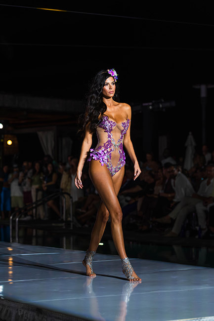 Miami Swim Week Model in purple bathing suit